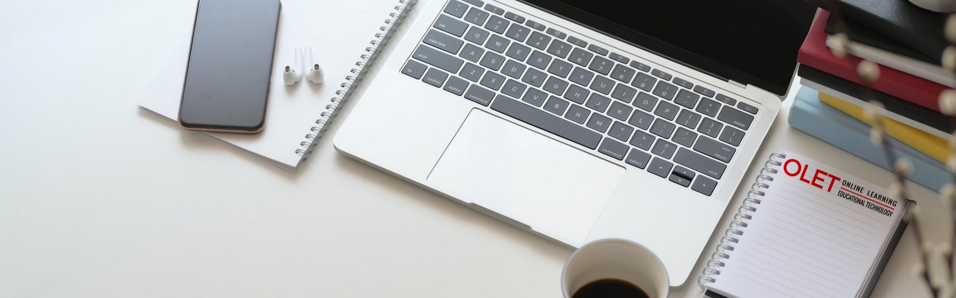 Banner image of a computer, smartphone, and books.