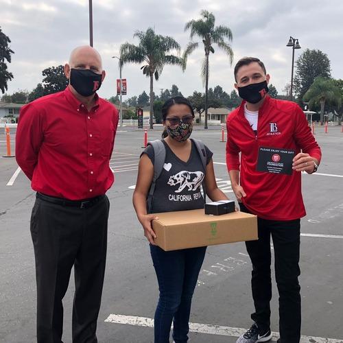 LBCC Staff handing out Chromebooks.