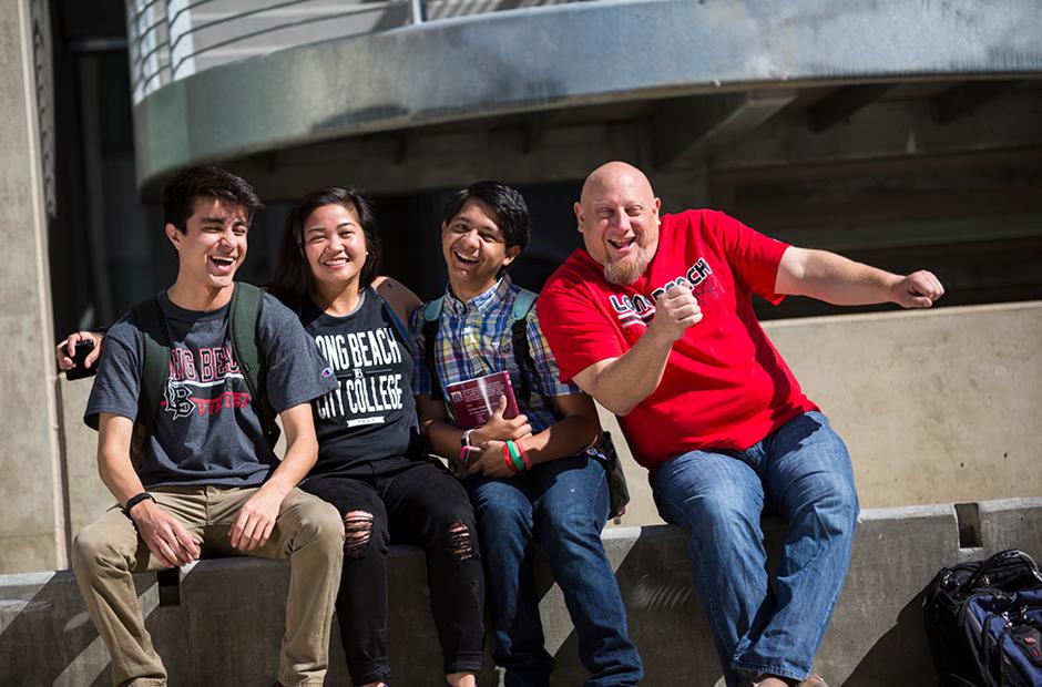 LBCC international students sitting next to each other laughing