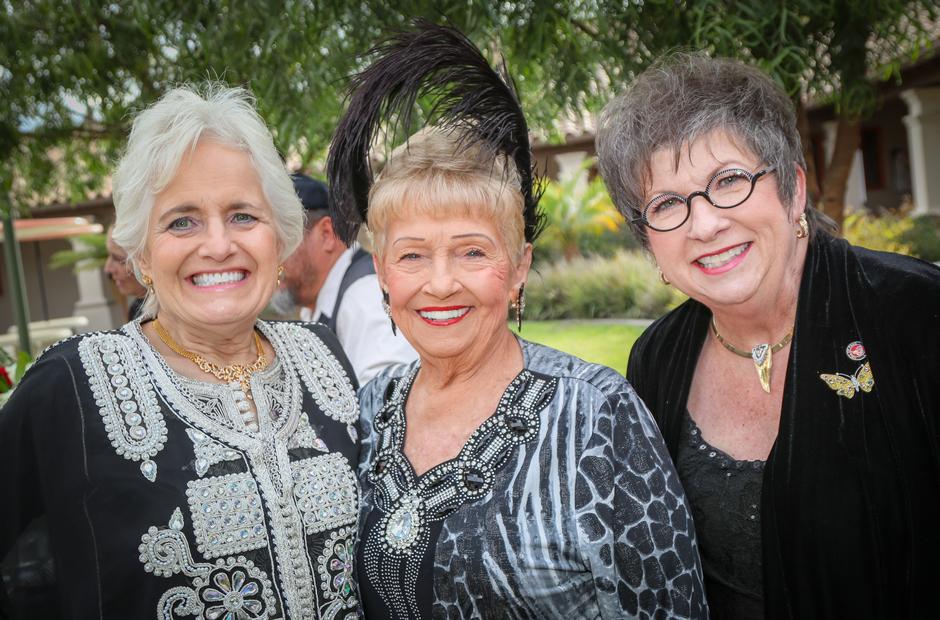 Women dressed in 1920s garb at the 90th Anniversary Gala.