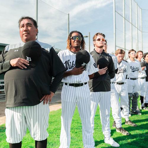 Viking baseball players during the national anthem.