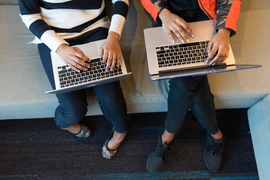 Two Students with Laptops