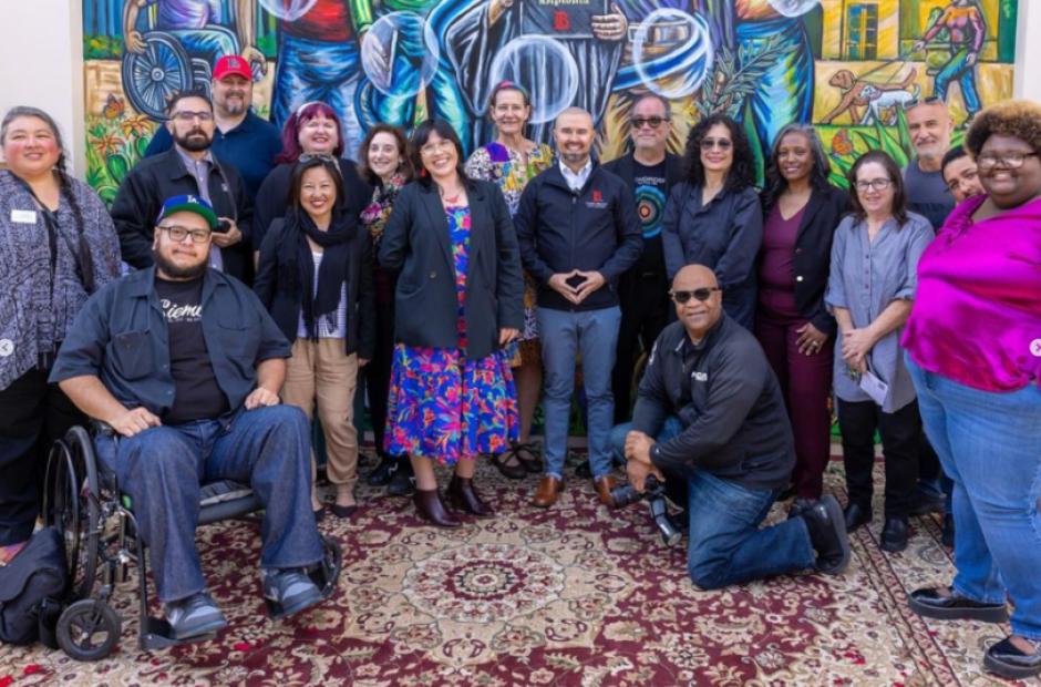 LBCC Staff group shot in front of a mural - LAC