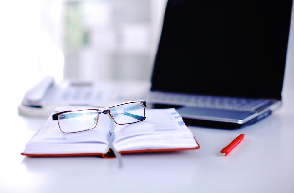 Group of multicolored office folders and glasses