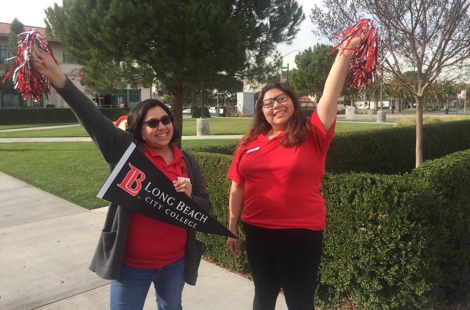 Two Outreach Ambassadors cheering.