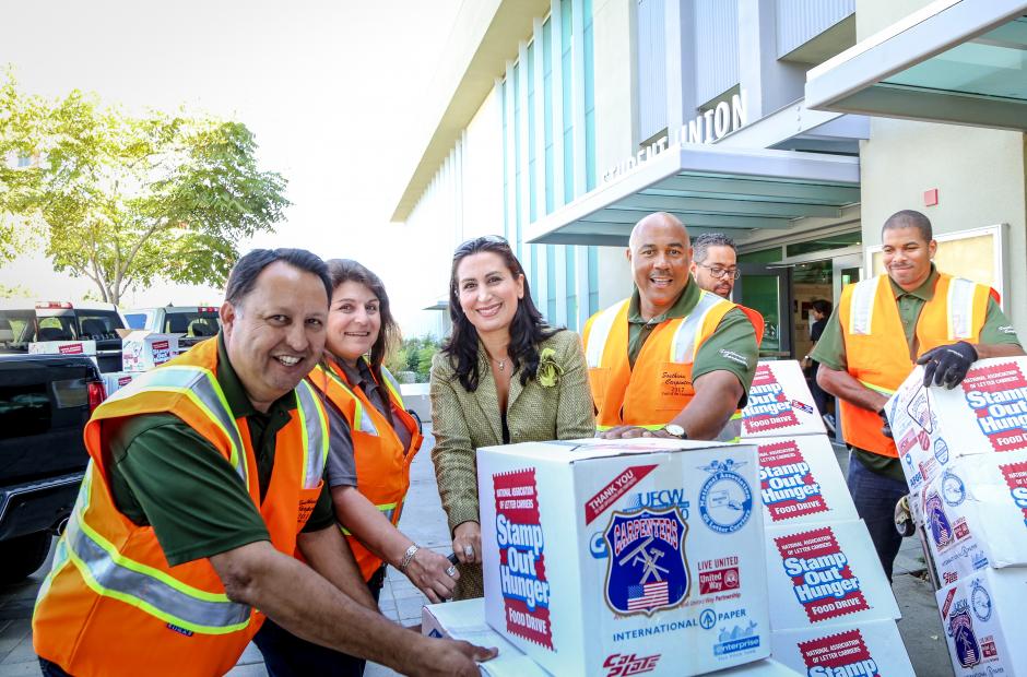 Trustee Zia with Carpenters delivering food