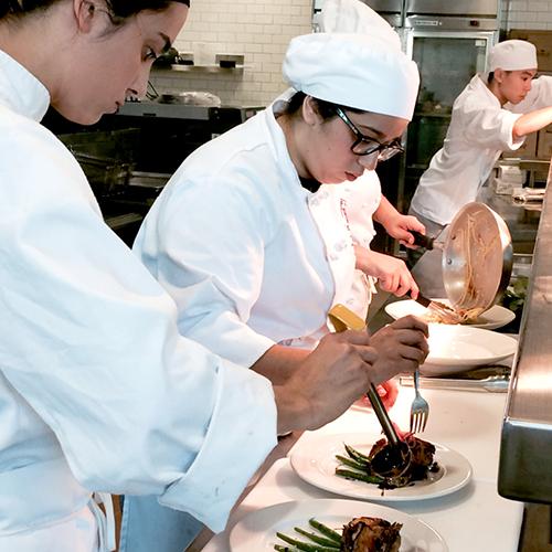 Advanced LBCC Culinary Students Utilizing Their Plating Skills in the Advanced Restaurant Practicum Class