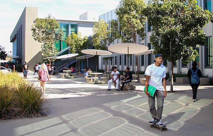 TTLC-  student life on campus- a young male student on a skateboard