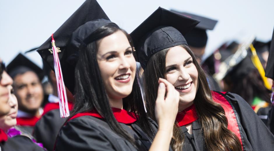 Two LBCC graduates in their cap & gown.