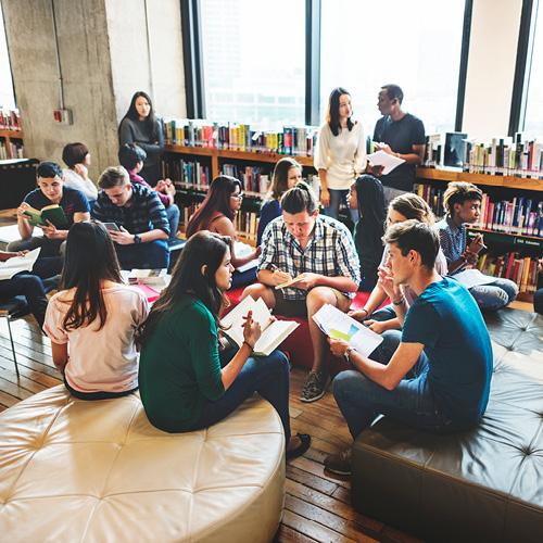 Diverse education, people reading in the library