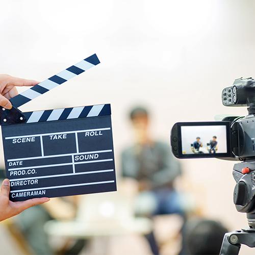 Man hands holding movie clapper