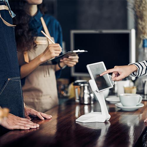 Customer self service order drink menu with tablet screen at cafe counter bar,seller coffee shop accept payment by mobile.digital lifestyle