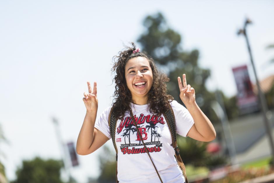 A student holding up the "peace" sign.